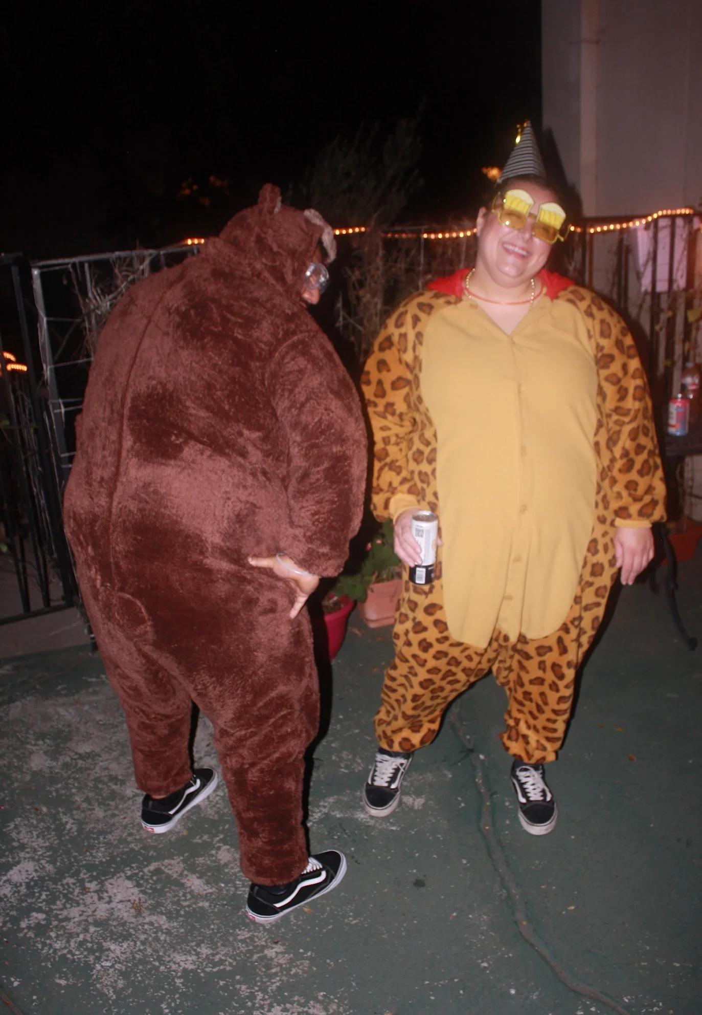 Two friends posing in animal costumes